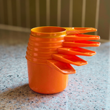 Orange Tupperware Measuring Cups