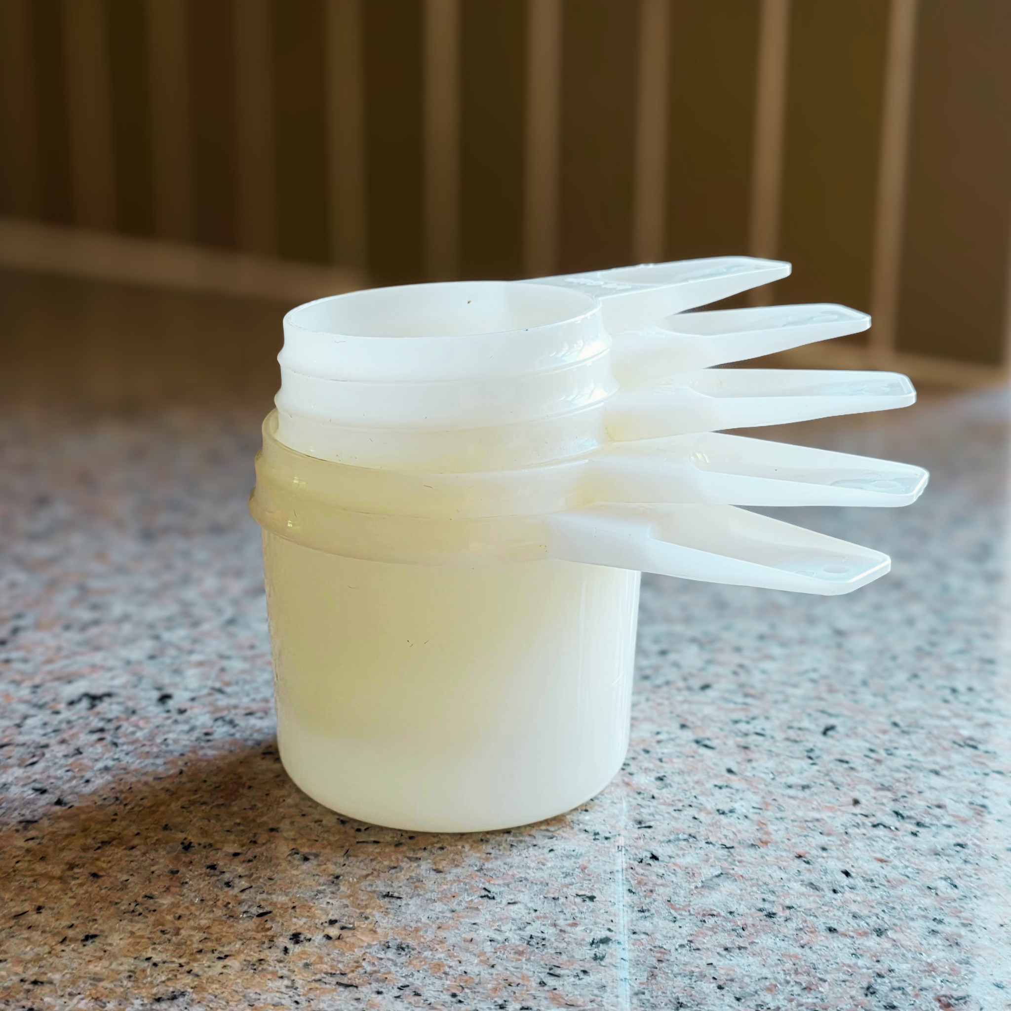 White Tupperware Measuring Cups